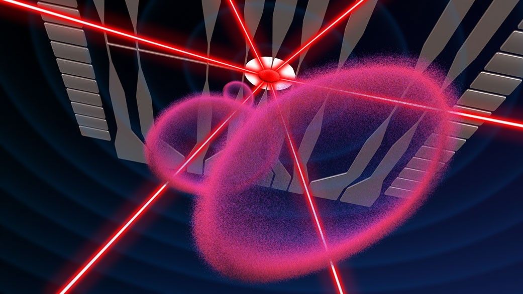 Rings of pink bubbles float above what appears to be a gray computer chip, with red laser beams shooting through.