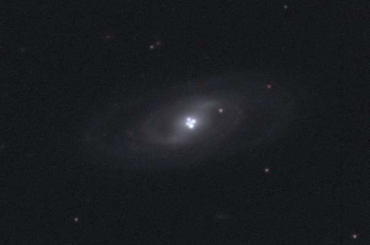 The Einstein Cross Gravitational Lens