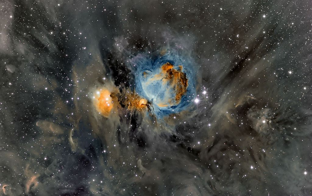 APOD: 2014 March 25 – Orion Nebula in Surrounding Dust