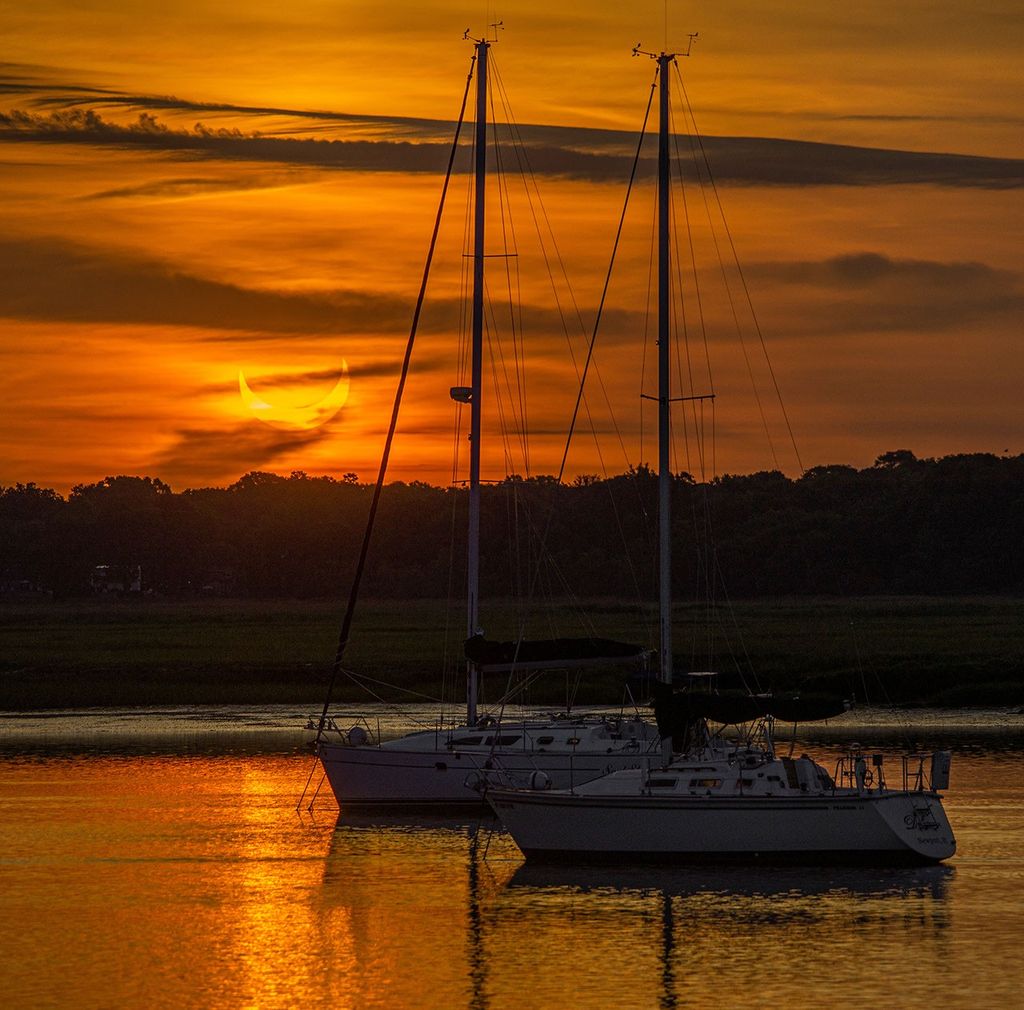 APOD: 2021 June 12 – Eclipse on the Water