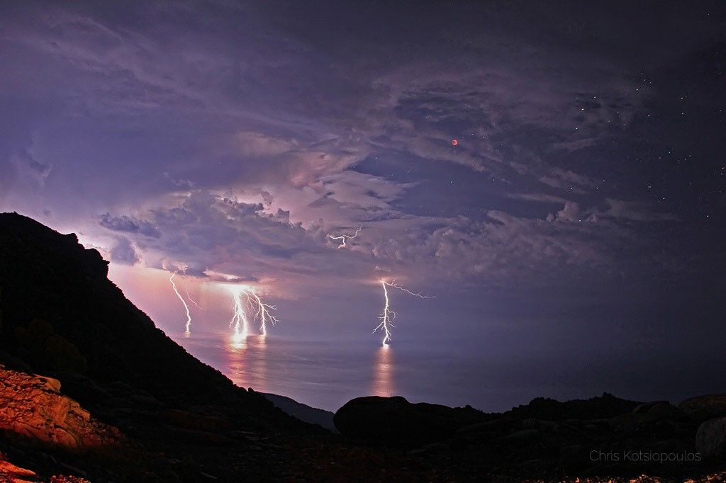 APOD: 2021 May 24 – Lightning Eclipse from the Planet of the Goats