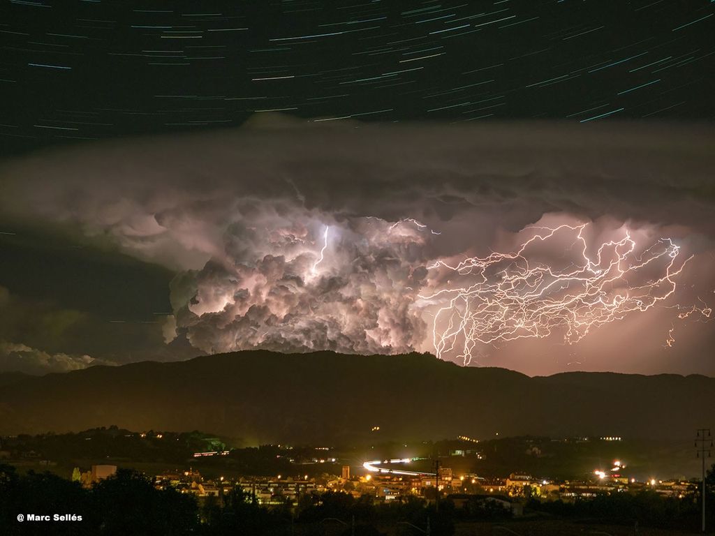 APOD: 2022 September 19 – Star Trails and Lightning over the Pyrenees