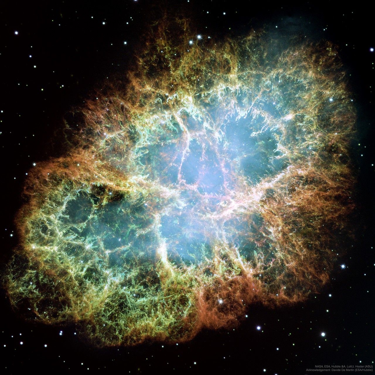 A messy array of colorful filaments is shown in front of a field of stars. Please see the explanation for more detailed information.