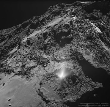 A dark and jagged hill is shown strewn with rocks. On the slope is a white foggy area that appears to emanate from a non-descript place on the rock face. Please see the explanation for more detailed information.