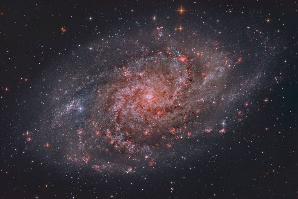 APOD: 2023 October 13 – Hydrogen Clouds of M33