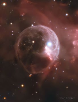 A starfield is shown with a big light bubble in the center. A bright star is toward the upper right in the translucent bubble. To some, the bubble may resemble a skull. Please see the explanation for more detailed information.
