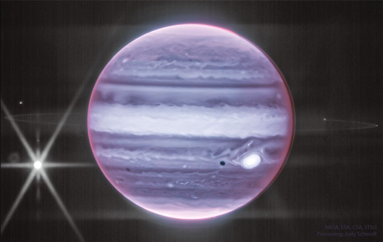 The featured image shows Jupiter in infrared light as captured by the James Webb Space Telescope. Visible are clouds, the Great Red Spot -- appearing light in color -- and a prominent ring around the giant planet. Please see the explanation
