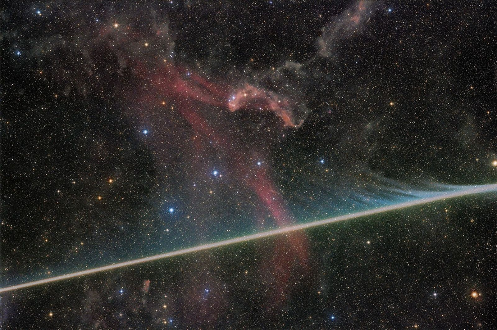 A meteor crosses a photograph of the Lacerta Nebula artwork