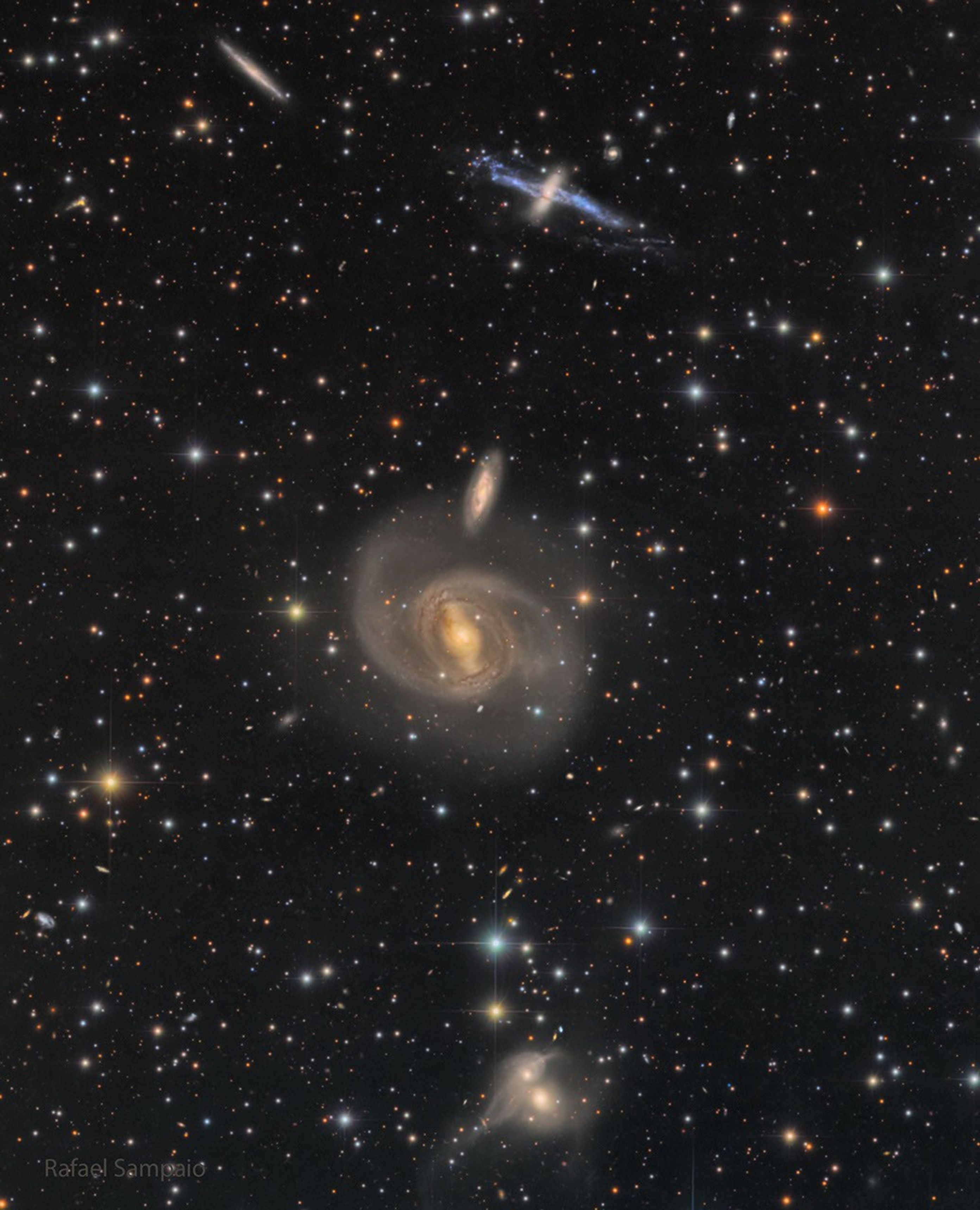 Three galaxy pairs are arranged vertically in the same field of view..