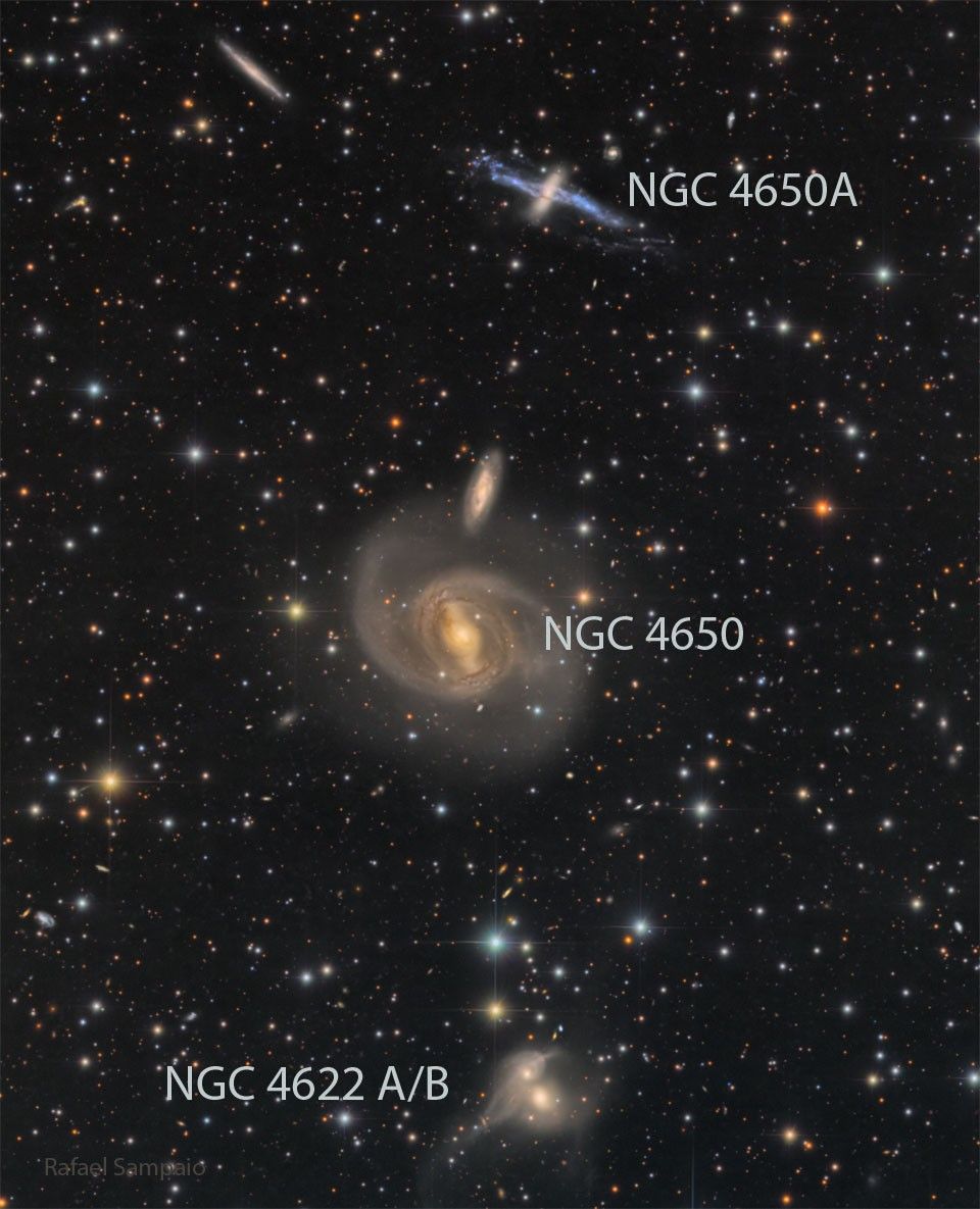 Three galaxy pairs are arranged vertically in the same field of view..