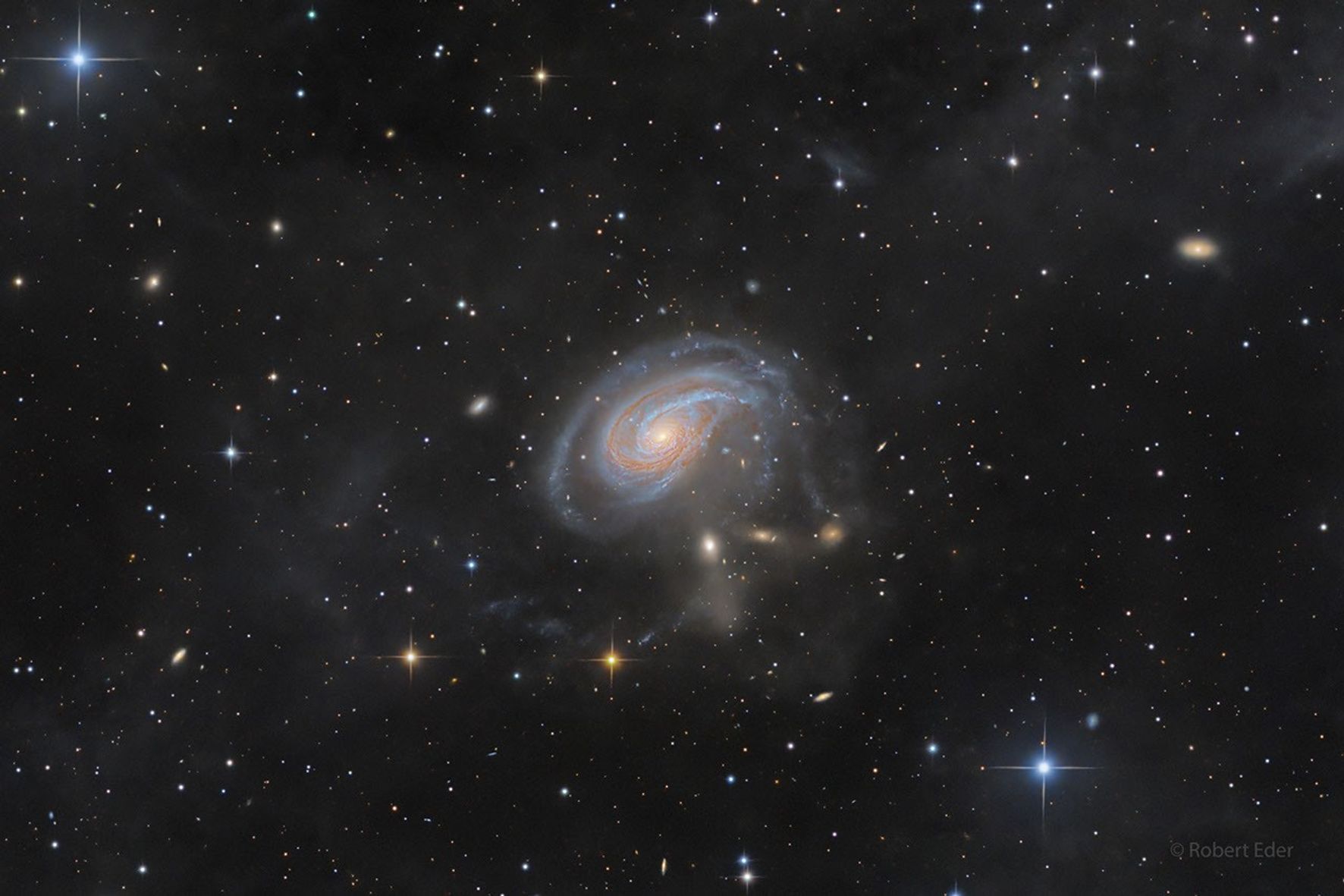 A spiral galaxy viewed face-on with an extended spiral arm.