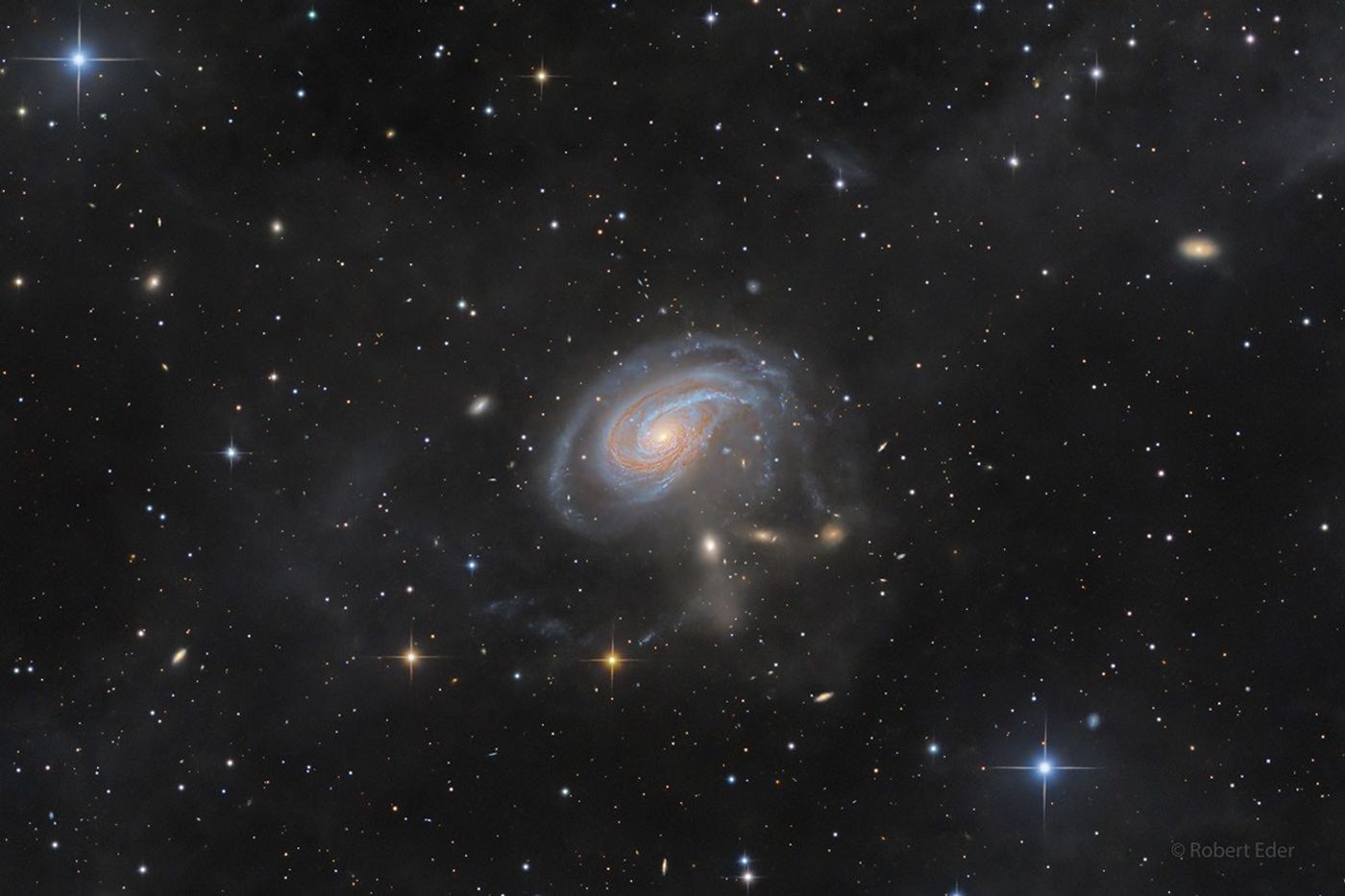A spiral galaxy viewed face-on with an extended spiral arm.