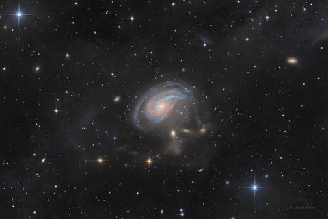 A spiral galaxy viewed face-on with an extended spiral arm.