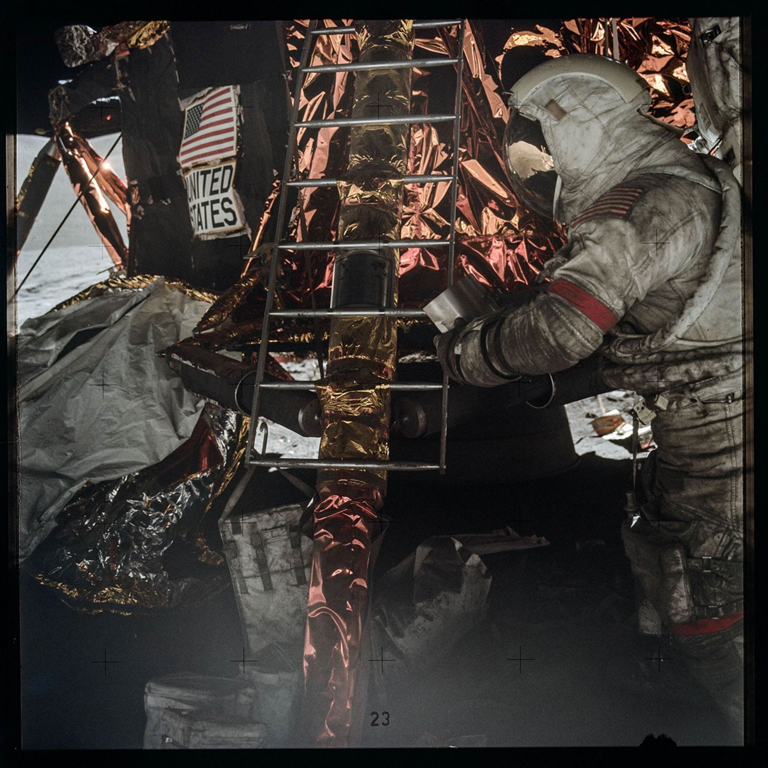 Astronauts at work on a lunar lander on the surface of the Moon, with their suits covered in Moon dust