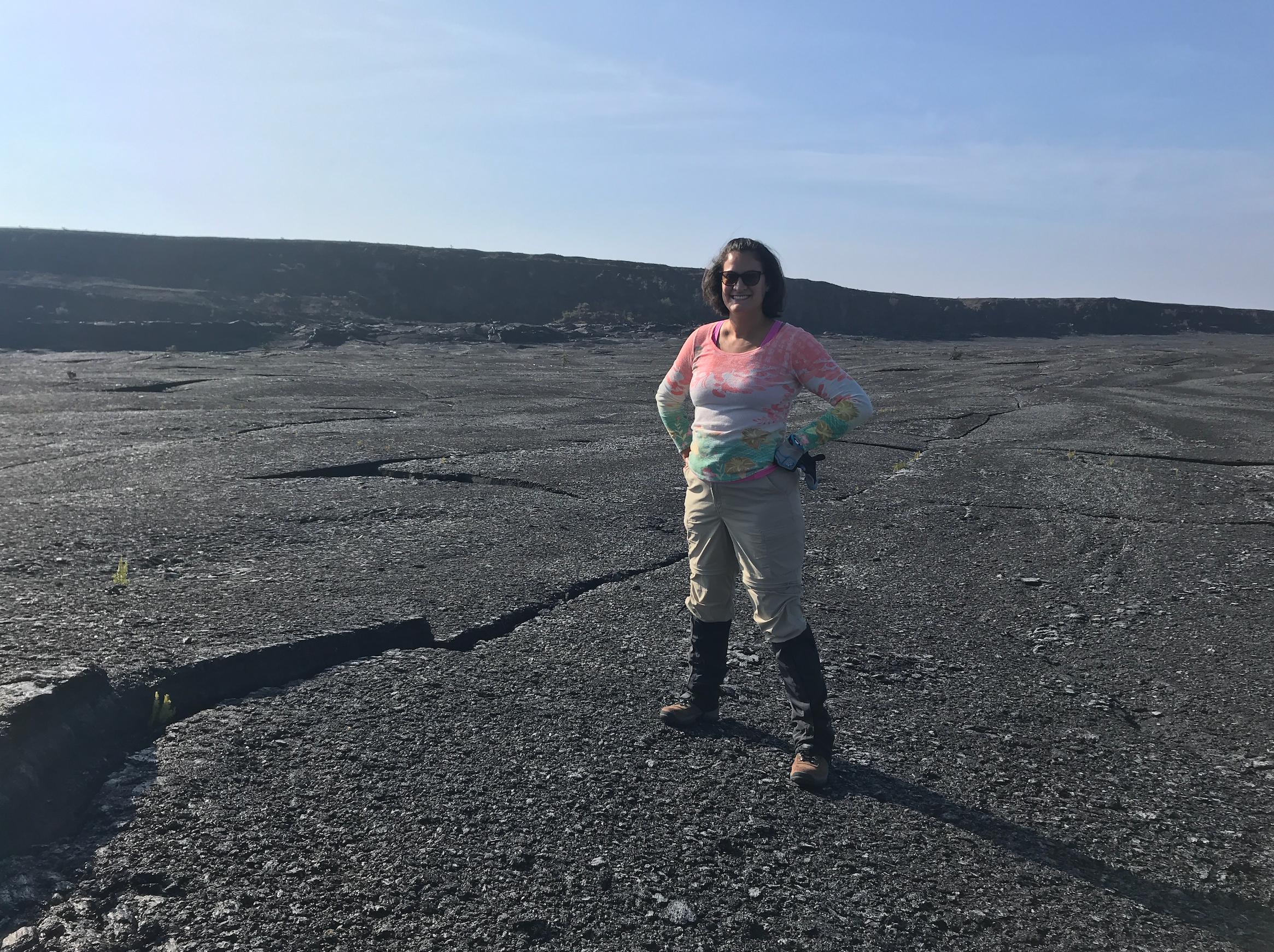 Dr. Santiago-Materese on a rocky surface in Hawaii.