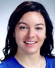 Portrait photo of a smiling woman with dark hair
