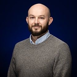 Portrait photo of a bearded man