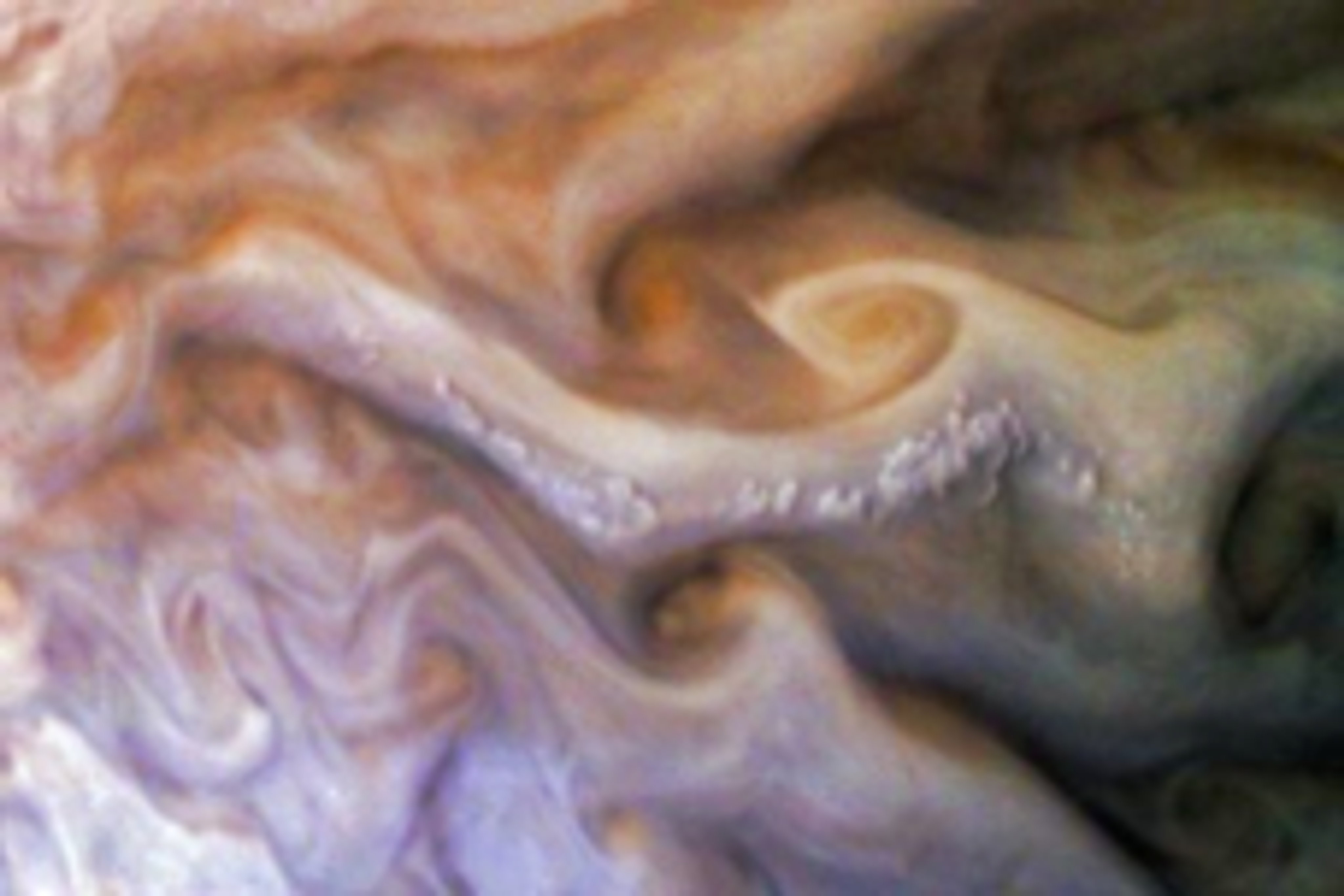 Close-up image of Jupiter&#039;s atmosphere featuring swirling cloud formations in shades of orange, brown, and cream, with a prominent pop-up cloud structure and dynamic patterns of turbulence.