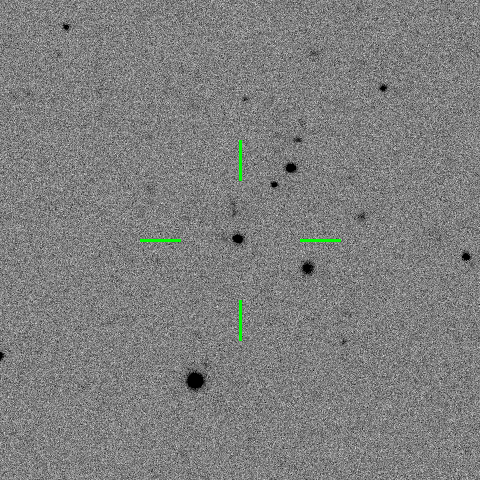 Black and white image of asteroids with a central object marked by green crosshairs, indicating a detected asteroid or celestial body.