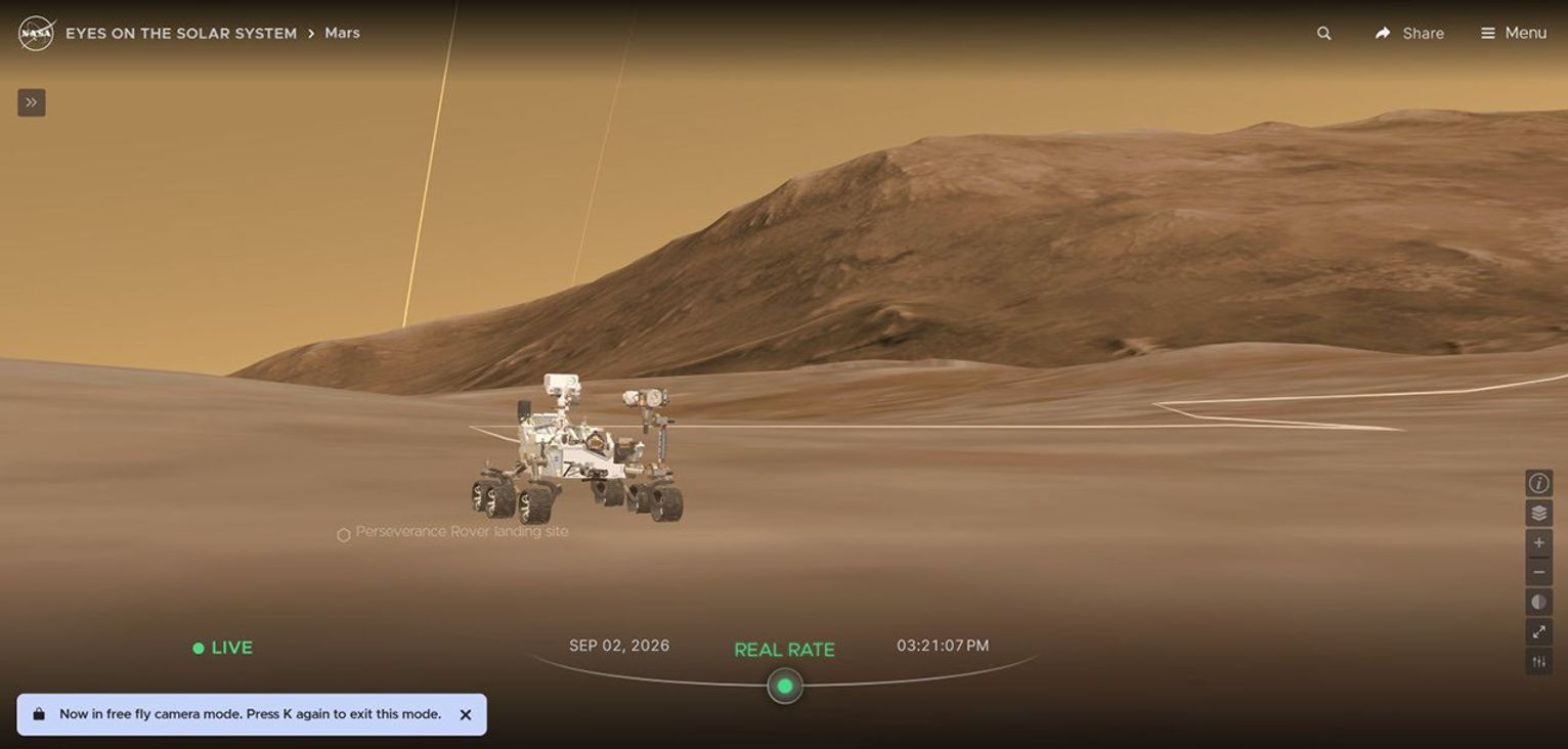 An image of the Perseverance rover sitting on Mars in its current position with full 3D terrain simulated in Eyes on the Solar System.