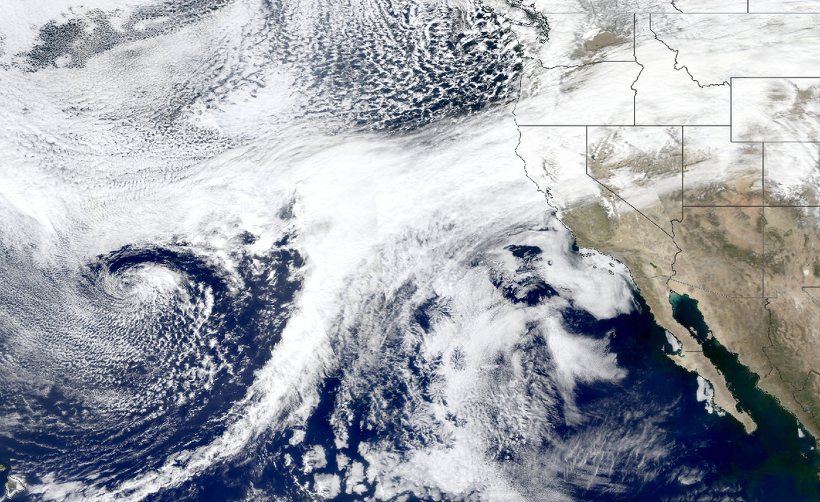 An image from space showing an atmospheric river in the Pacific Ocean impacting the west coast of the United States.