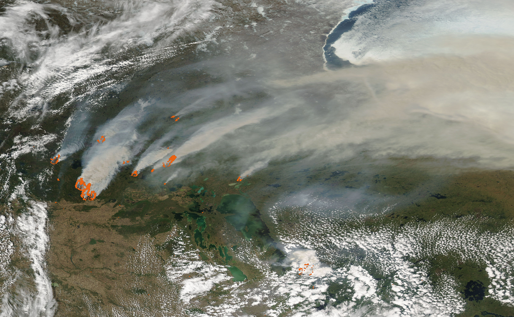 A view from orbit above Canada with orange dots representing current Canadian wildfires as of May 28th, 2025.