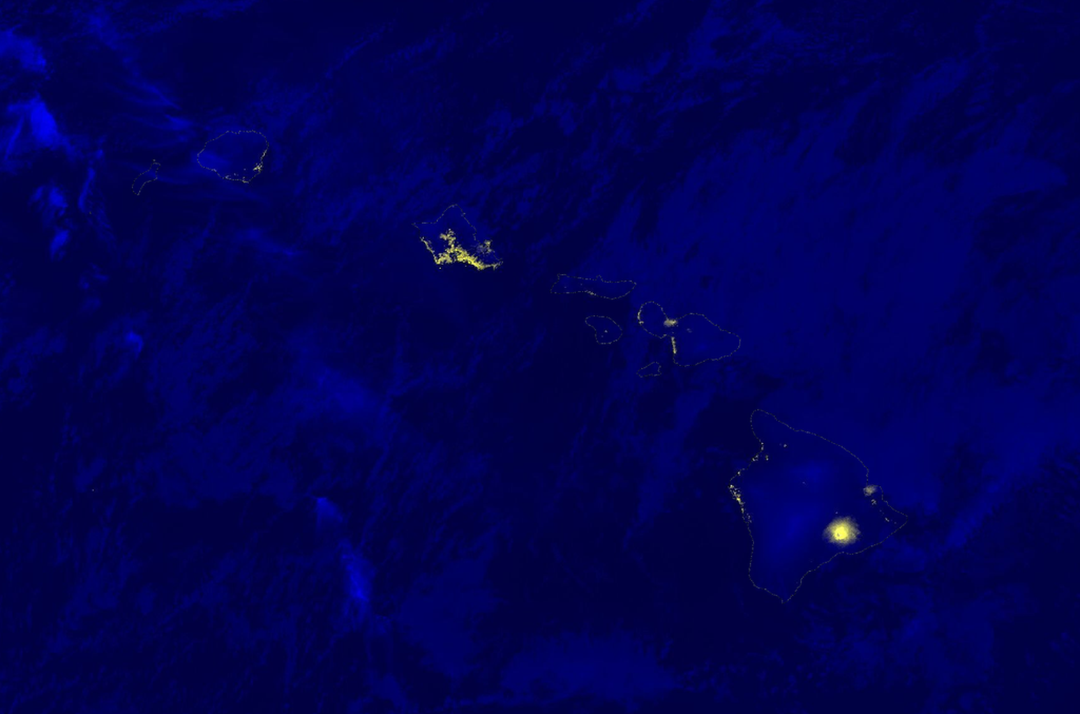 A night-time image of Hawaii showing molten lava erupting at the Kilauea volcano.
