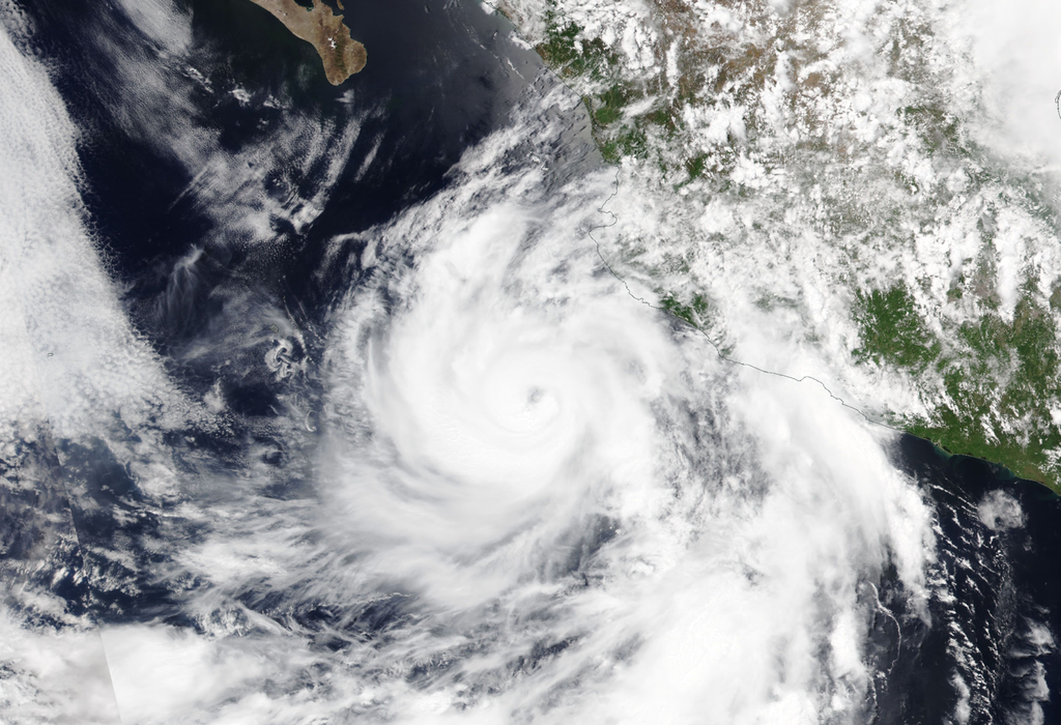 A view from Earth orbit above western Mexico and the Pacific Ocean, showing a real image of Hurricane Flossie on July 1st, 2025. .