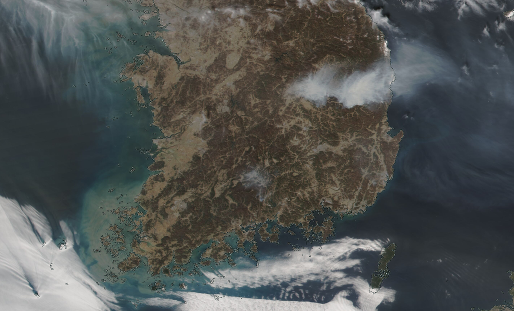 An image from orbit showing smoke plumes emanating from the Korean peninsula, taken by the NOAA-21 satellite on March 26th.