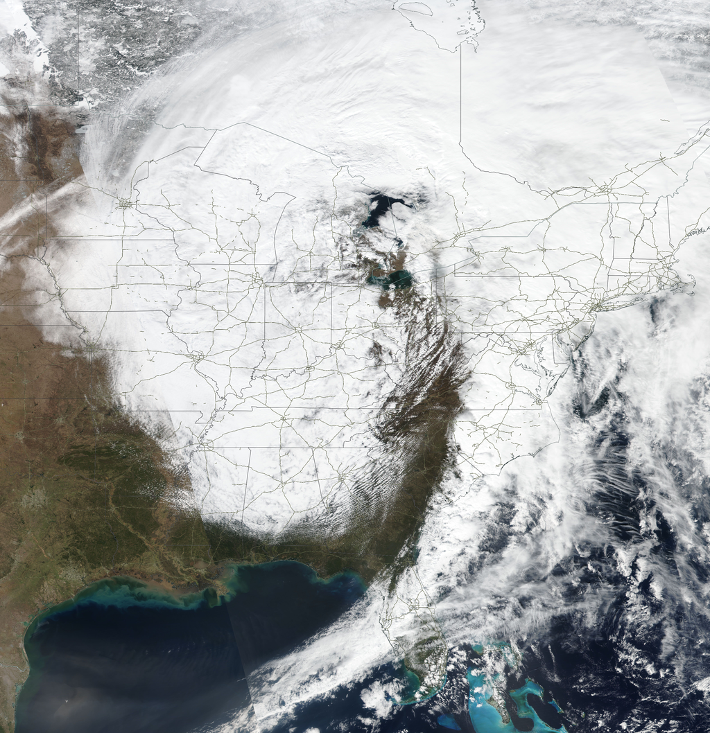 An image from orbit showing widespread snow and blizzard conditions in the central and eastern USA.