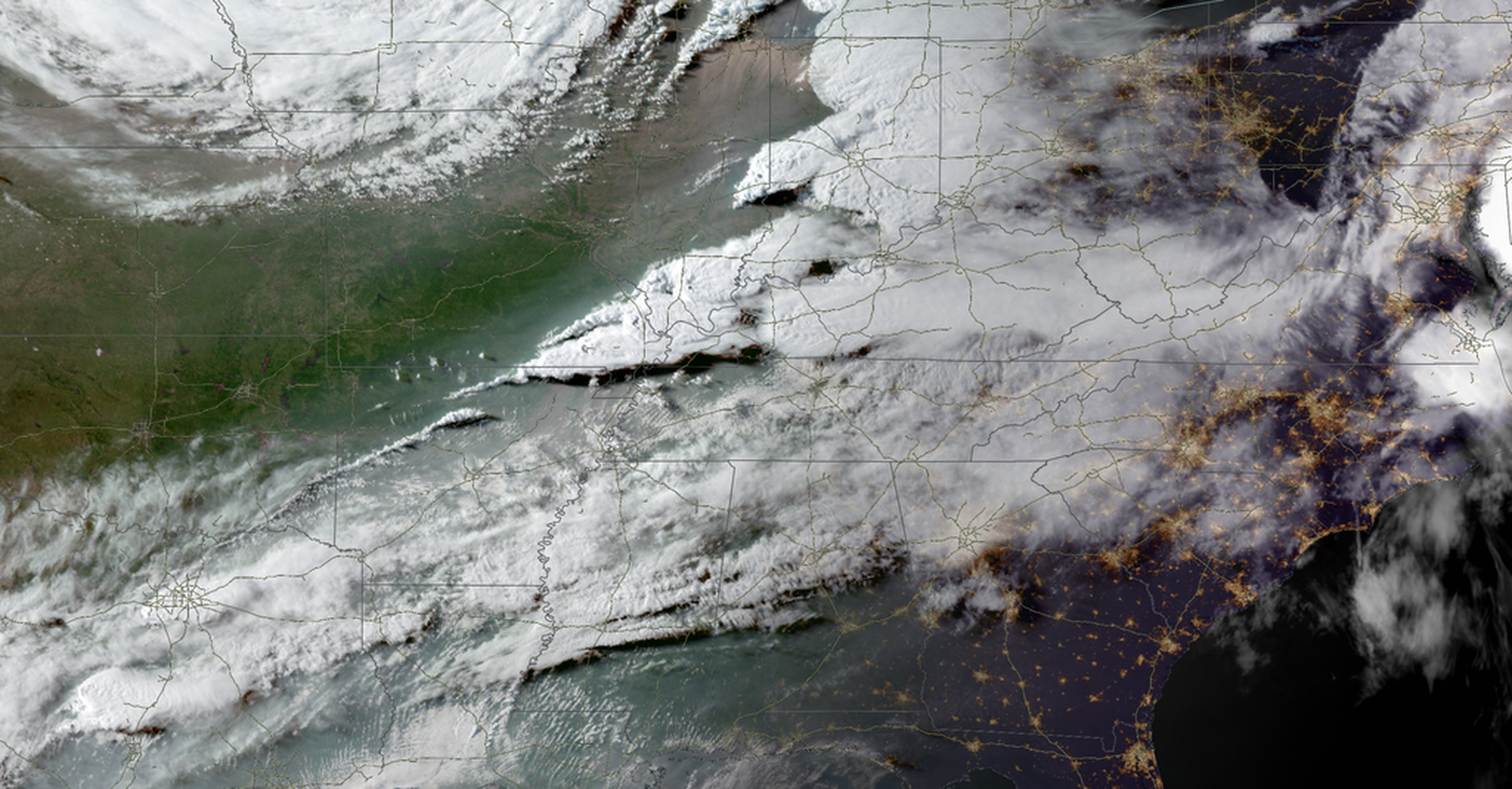 A view from orbit above the eastern two-thirds of the USA showing heavy cloud cover.