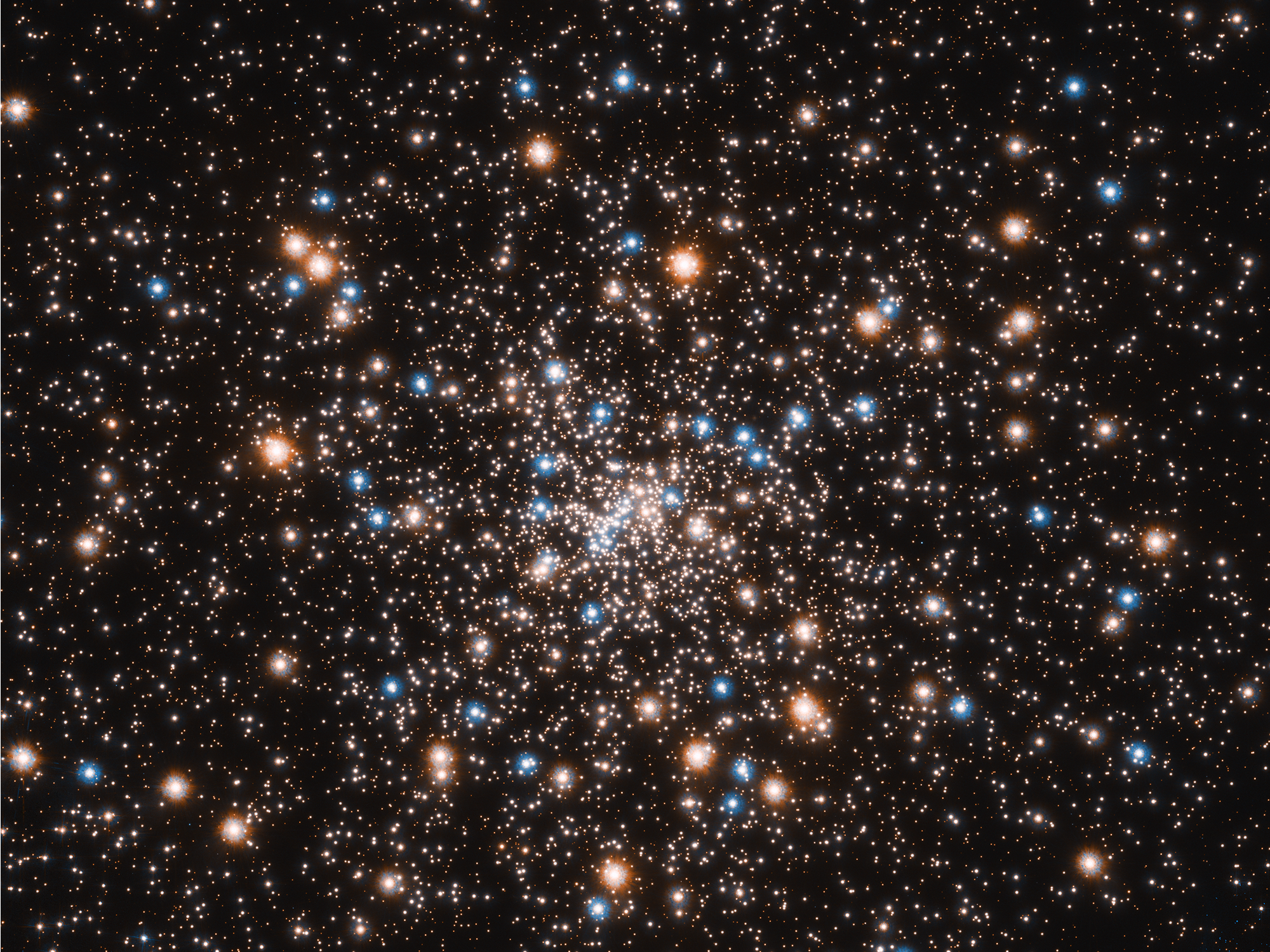 Una lluvia de estrellas multicolores agrupadas.