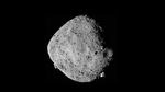 A full disc view of Bennu, whoing its surface littered with giant boulders.
