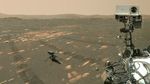 A small helicopter sits on the surface of Mars near the much larger Perseverance rover.