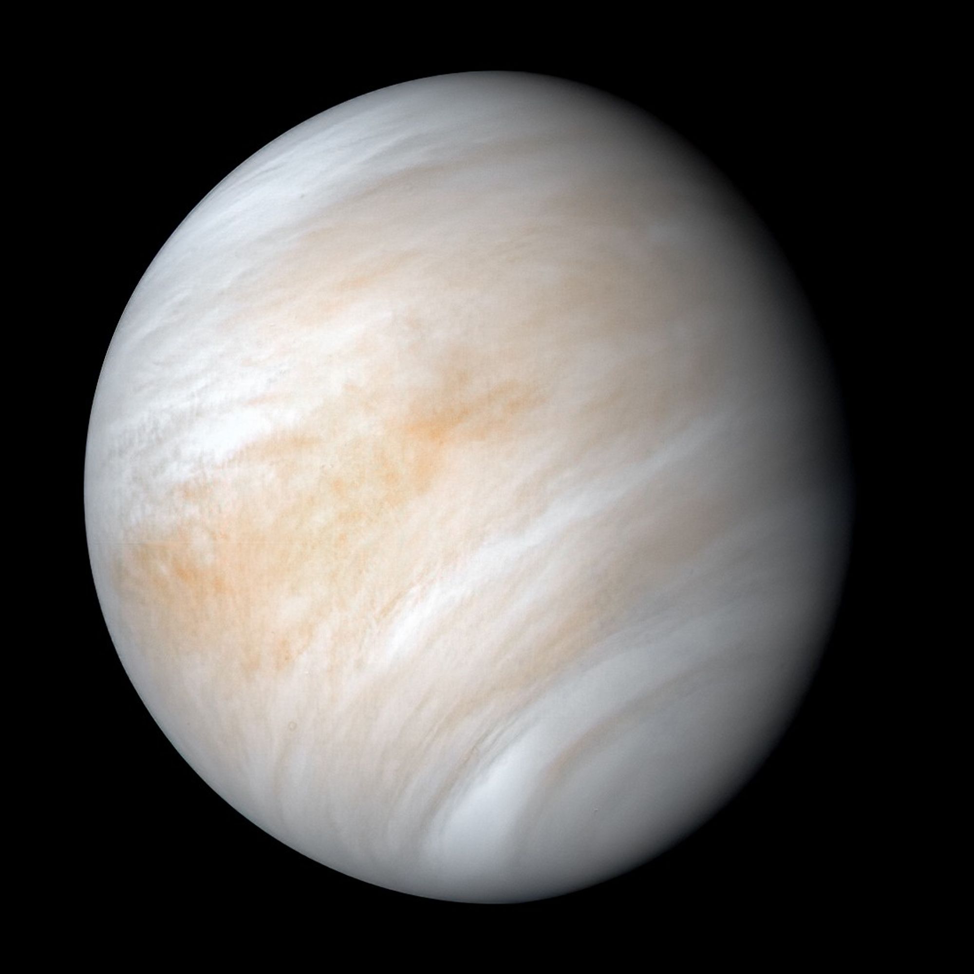 Venus shrouded in swirling bands of white, tan, and orange clouds, photographed by NASA's Mariner 10 spacecraft