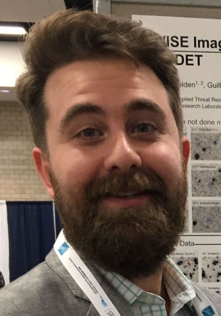 Portrait photo of a bearded young man