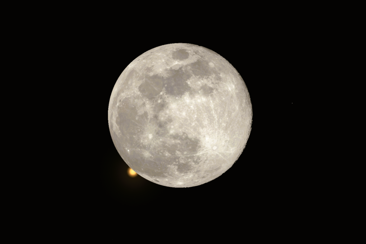 A detailed image of the Full Moon dominating the frame against a black night sky. Below the lower-left edge of the Moon, Mars appears as a small, bright reddish-orange dot, partially hidden as it undergoes an occultation by the Moon. The Moon's surface is detailed with visible craters and maria.