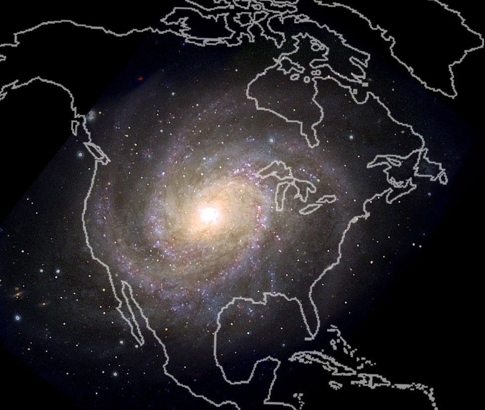 A spiral galaxy image representing the Milky Way is overlaid with an outline of the North American continent. The bright galactic core is positioned roughly over the central United States, with the galaxy’s spiral arms extending into the surrounding regions, including Mexico, Canada, and the Atlantic Ocean.