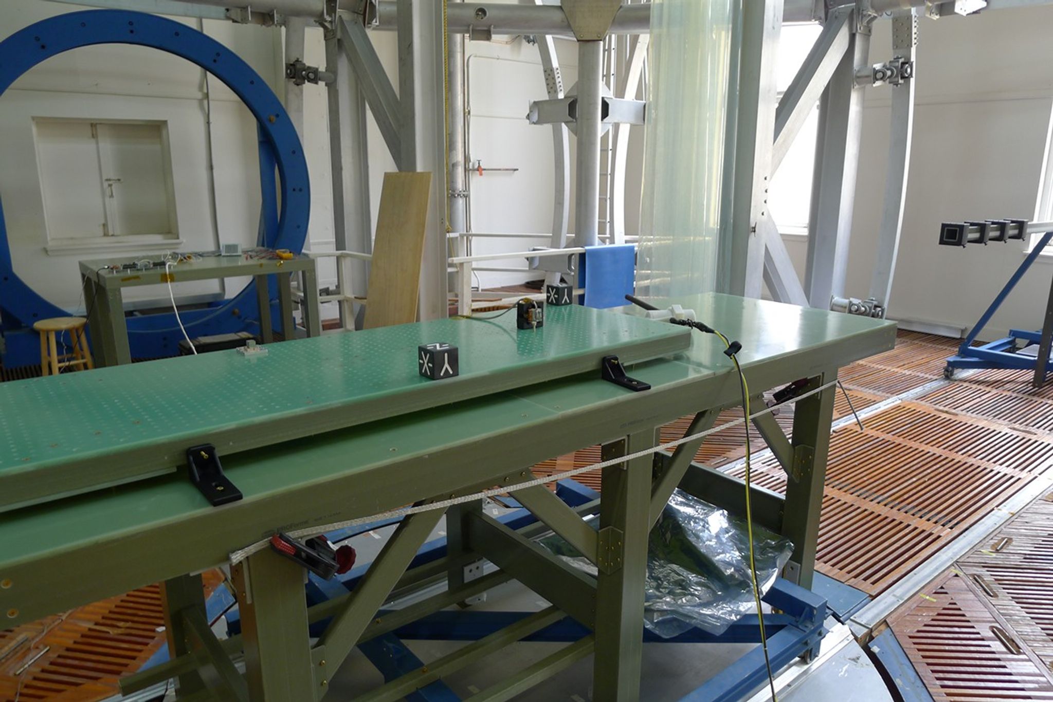 A sensor in a black box on a green table in a calibration facility