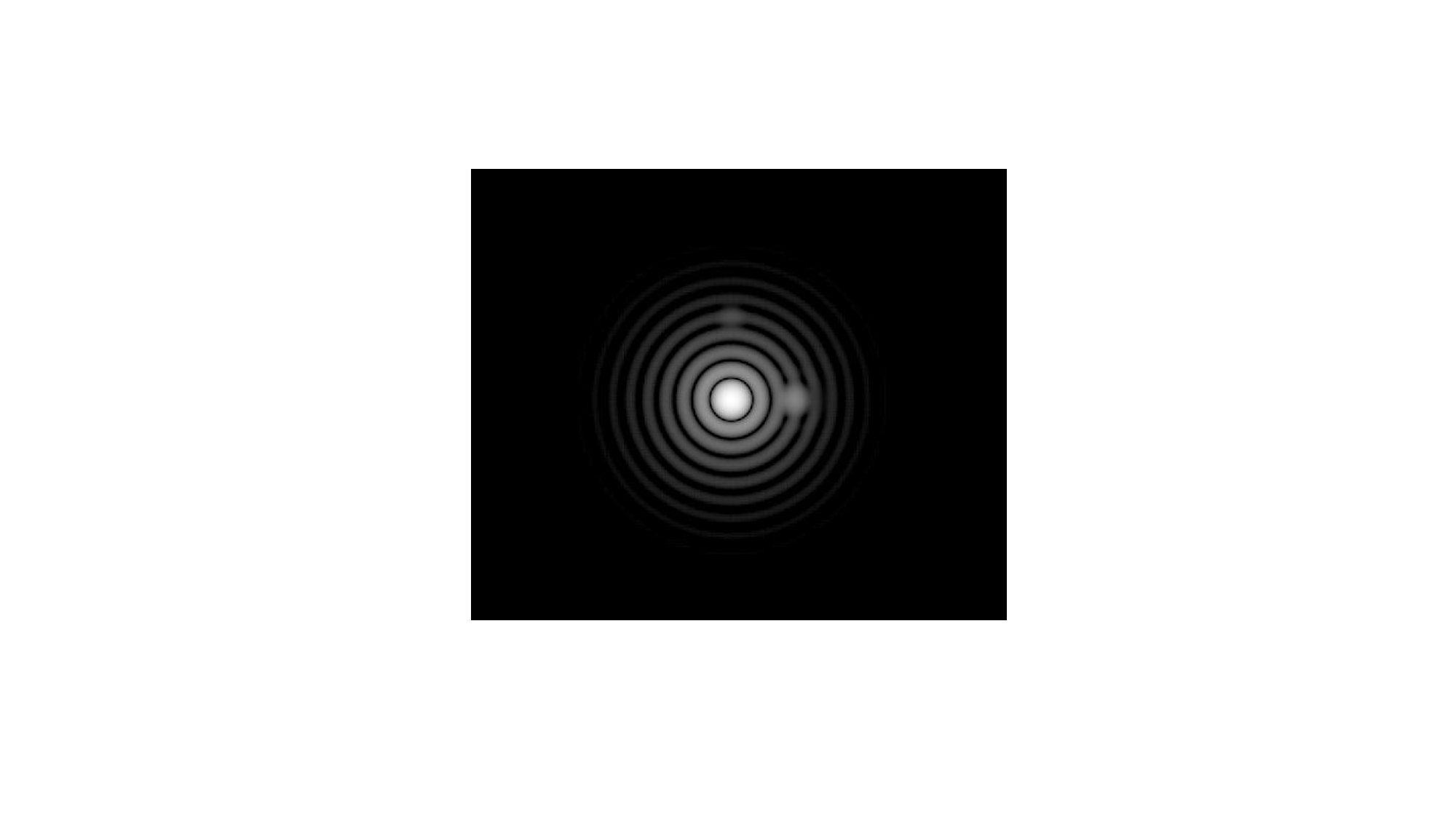 Concentric white circles on a black background, with two circles around the center at 12 o'clock and 3 o'clock