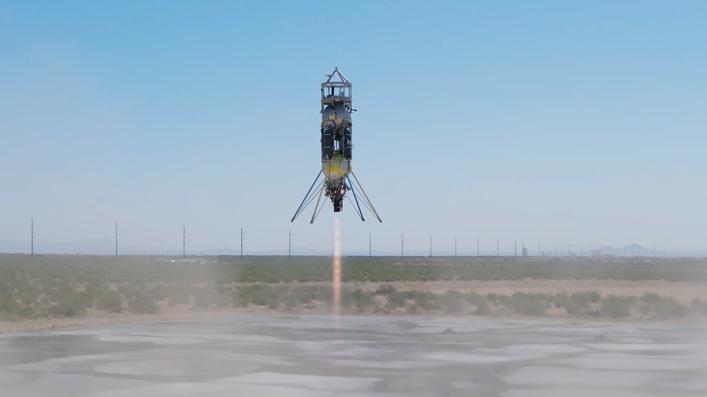 A Astrobotic Xodiac suborbital rocket lander taking off vertically.