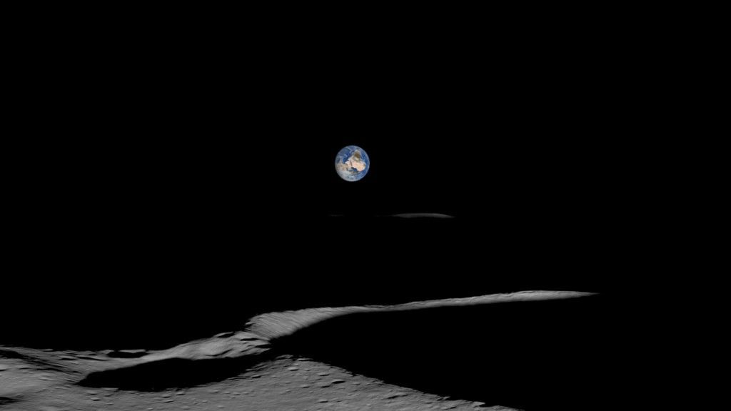 A visualization of the Earth as seen from near the Moon's South Pole. The blue and brown Earth globe is shown above a dark lunar horizon.