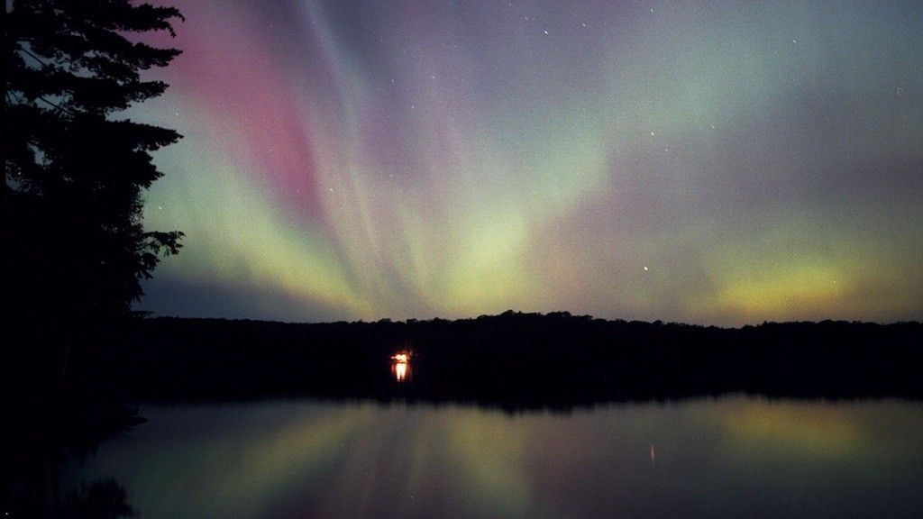 Occasionally auroras burst into a full suite of red, purple, and yellow tones.