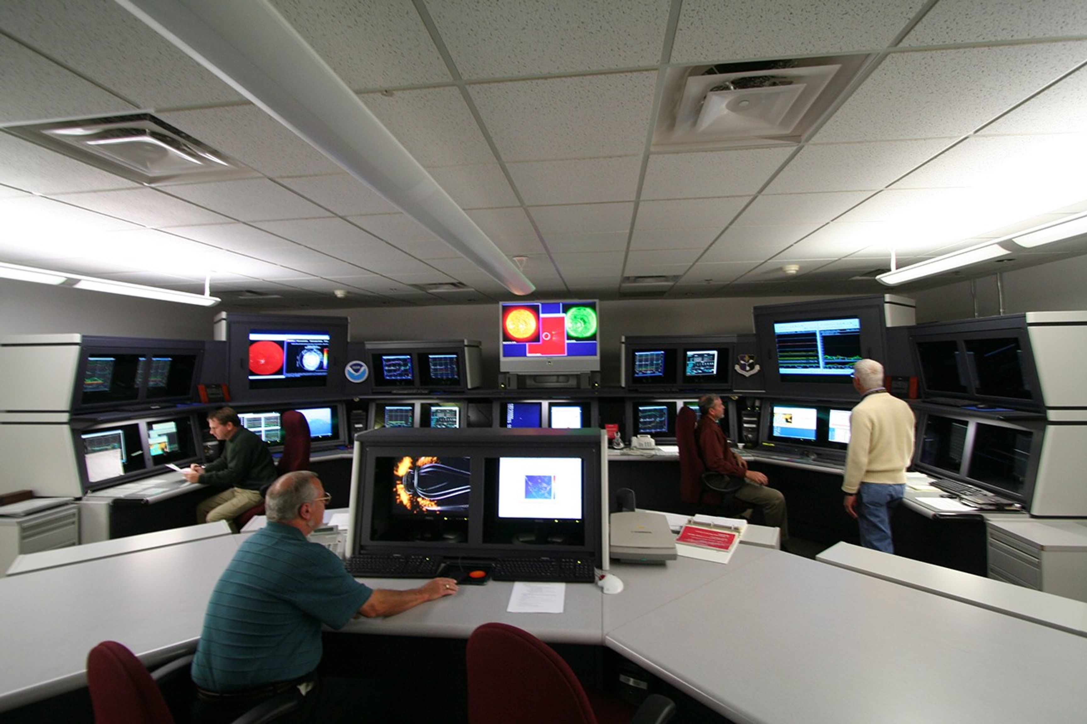 NOAA Space Weather Prediction CenterThe Space Weather Forecast Office is the heart of the NOAA Space Weather Prediction Center (SWPC).  The Forecast Office is staffed 24/7 and is the Nations official source of space weather alerts, watches, and warnings.The Space Weather Prediction Center is one of the nine centers of the National Centers for Environmental Prediction (NCEP) and is the only Center dedicated to space weather forecasting. The NCEP is part of the Nation Weather Service.The Space Weather Prediction Center also has Research and Development departments who's primary function includes the development and exploration of new models, tools, and data products that can improve the accuracy and lead times of the space weather forecasts.The NASA SDO research satellite provides valuable data for understanding and forecasting space weather. Data from all three SDO instruments (HMI, AIA, and EVE) are used in the NOAA Forecast Office. The Forecast Office now uses SDO EVE data to provide backup for the GOES X-ray sensor during the regular daily eclipses of the sun that occur in the Fall and Spring.  In addition to the operational utility of SDO data, the new knowledge and scientific understanding that is generated by the SDO mission will improve the accuracy of space weather models and therefore, improve the accuracy of future space weather products and forecasts.Credit: SWPC/NOAA