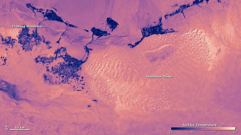 Hot landscapes appear bright, while cooler vegetation appears dark when viewed by satellite temperature sensors.