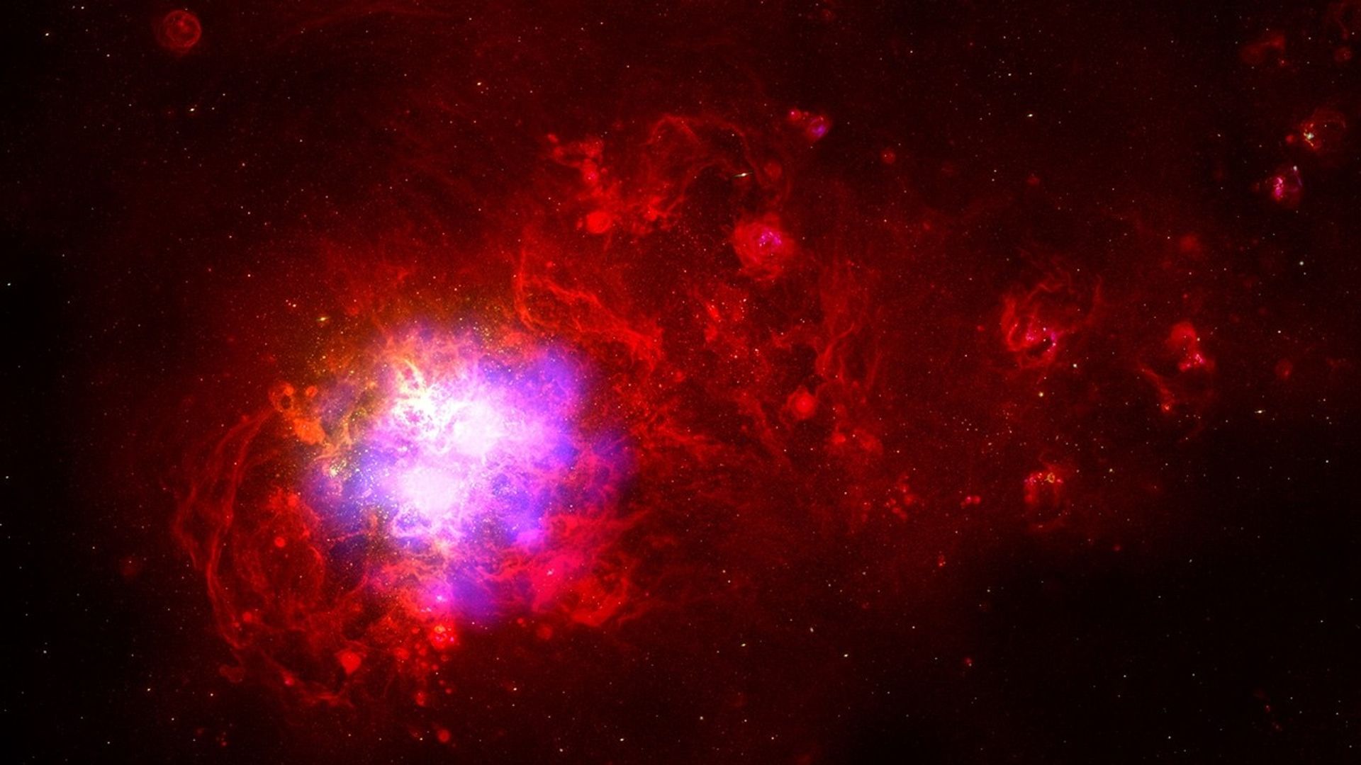Image of a portion of the Large Magellanic Cloud with Fermi gamma-ray imagery showing bright sources centered on the Tarantuala Nebula.Credit:  C. Smith, S. Points, the MCELS Team, NOAO/AURA/NSF and NASA/DOE/Fermi LAT Collaboration