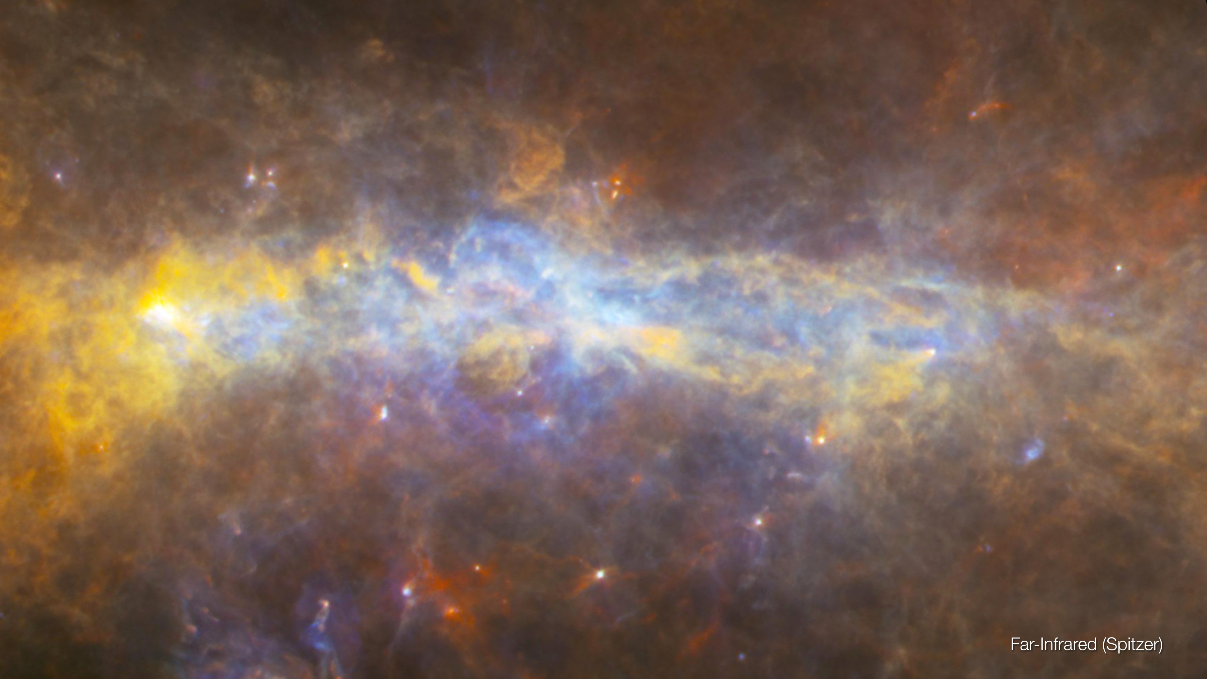 Far-infrared image of Galactic Center At these long infrared wavelengths, the hottest dust glows blue, while the coldest is red.