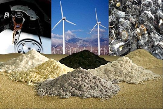 Four undergraduates presented a plan to convert "rare earths" into clean energy technology. Pictured here are five piles of oxidized rare-earth elements with three potential sources from which they can be recycled: hard drives, wind turbines and electric motors.