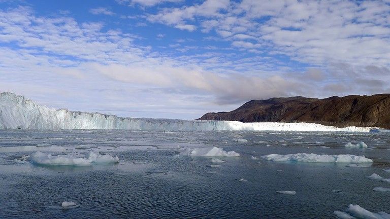 The new maps show that the seafloor under Store Glacier, shown here, is almost 2,000 feet (600 meters) deeper than previously thought. Credit: NASA/JPL-Caltech/Ian Fenty.