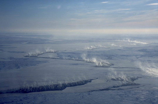 Cloud plumes from cracks of open water in the Arctic sea ice cover. Image credit: University of Hamburg, Germany